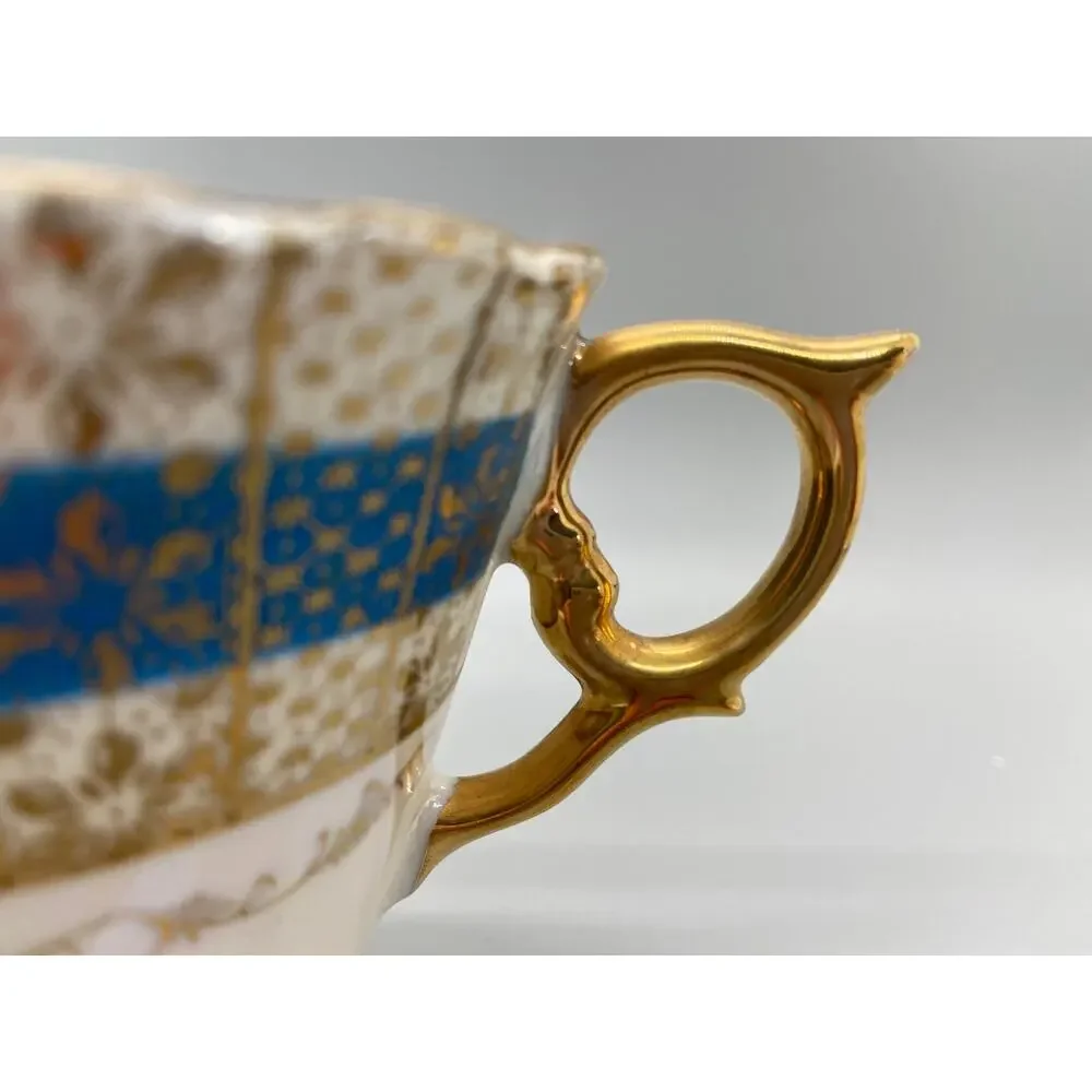 Vintage Porcelain Lusterware Tea Cup with Blue and Gold Toned Floral Design